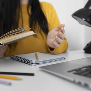 close-up-woman-holding-book close-up-woman-holding-book
